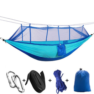 blue camping hammock with mosquito net